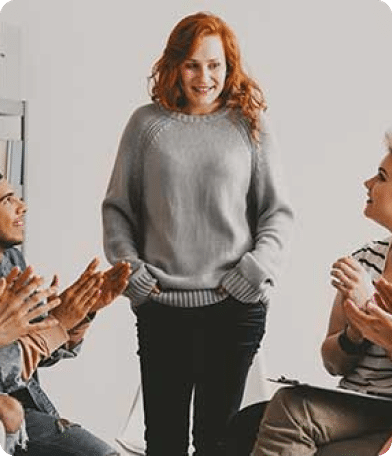 Suboxone Addiction Treatment 7 woman standing in front of group therapy