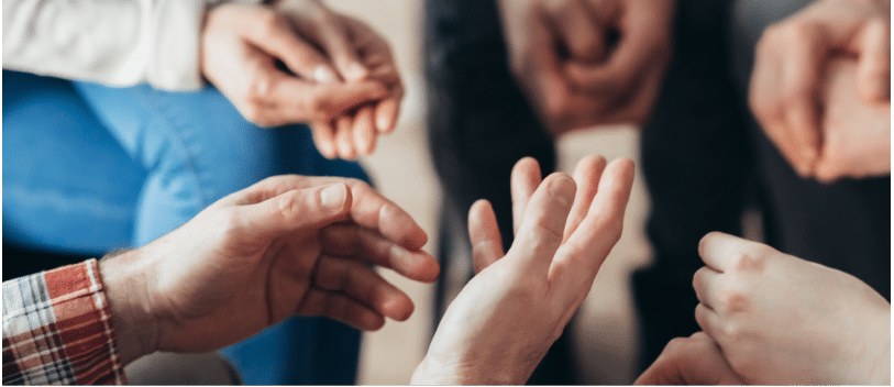 Opioid Addiction Treatment 3 hands together in group therapy