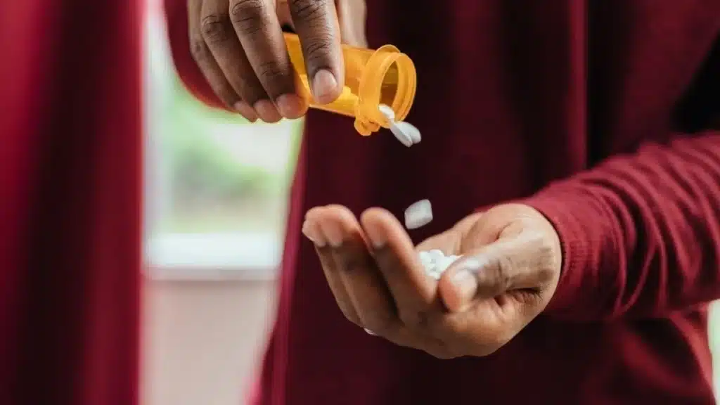 Understanding Opioids: What Are They? 11 Woman pouring pills out of a bottle into her hand. Graphic lists treatment options for opioid addiction including residential treatment and therapy.