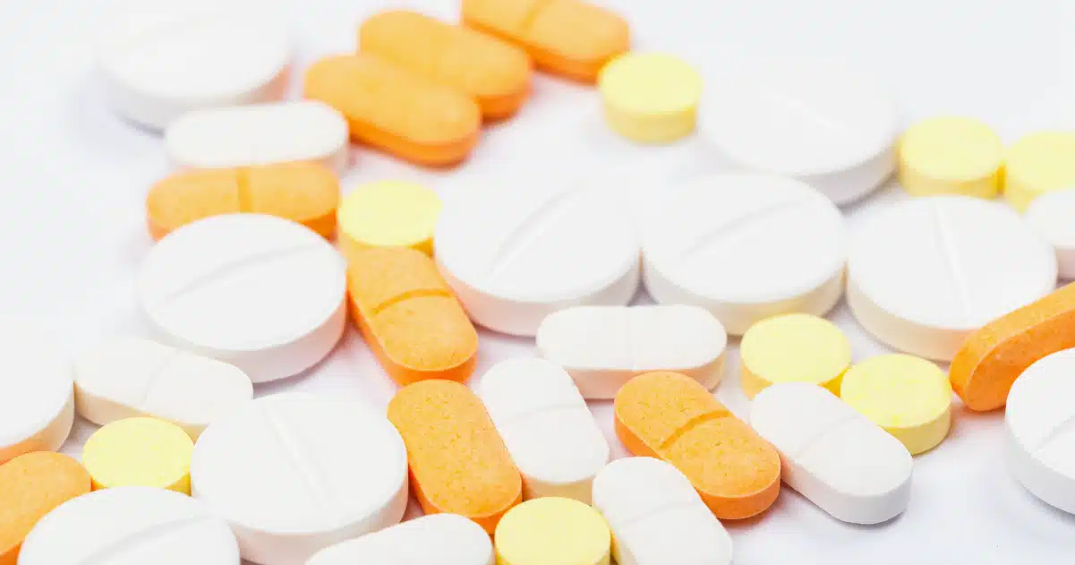 Pills laid out on a table.