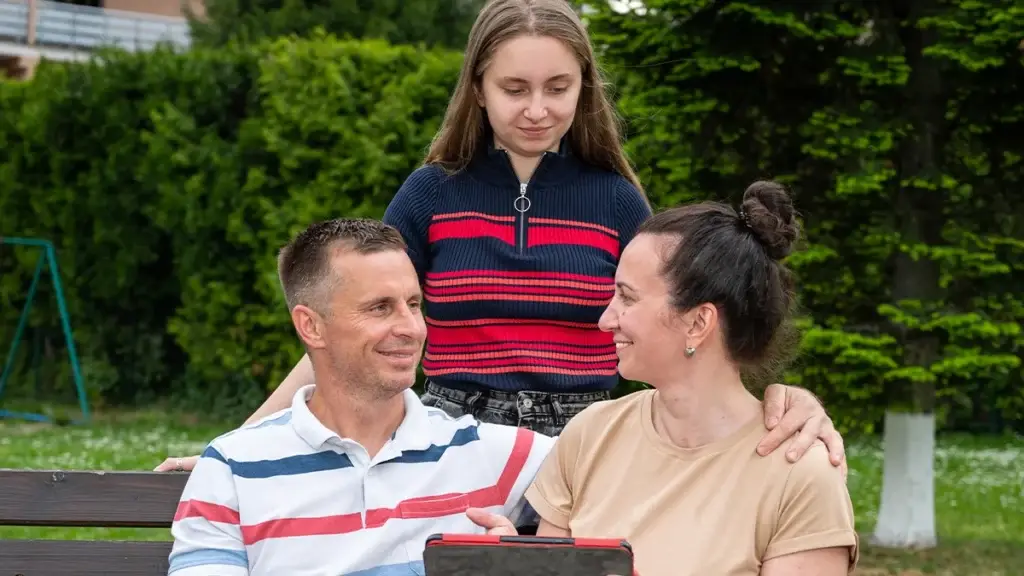 Prevention Strategies For Teen Drug Addiction 6 parents sitting on a bench with their child standing behind them